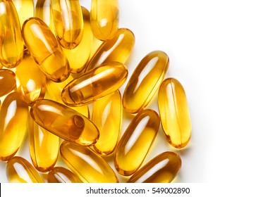 Pile of capsules Omega 3 on white background. Close up, top view, high resolution product.
