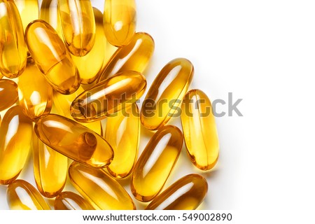 Pile of capsules Omega 3 on white background. Close up, top view, high resolution product.