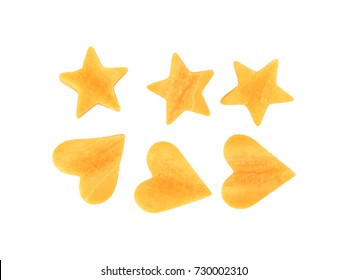 Pile of carrot slices is star and heart shapes isolated on white background