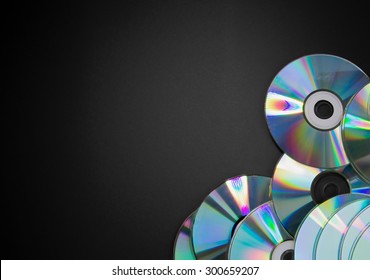 Pile Of CDs On Black Background