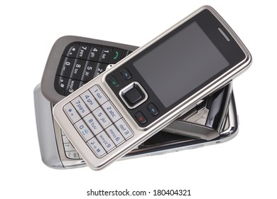 Pile Of Cell Phones, Cut Out On White Background