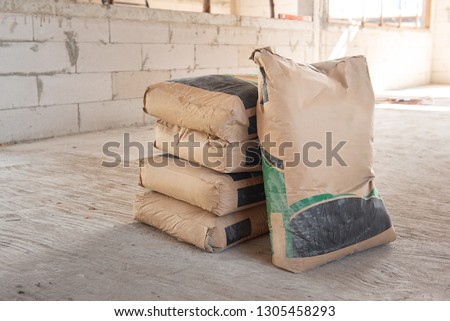 Pile of Cement in bags, stacked for a construction project.
