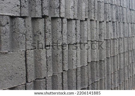
pile of cement bricks. Cement brick is one of the main materials that are often used for the manufacture of building walls