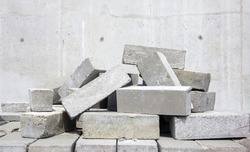 A Pile Of Cement Type Bricks. Solid Brick Is Used For Construction. Lots Of Loose Concrete Bricks At The Construction Site