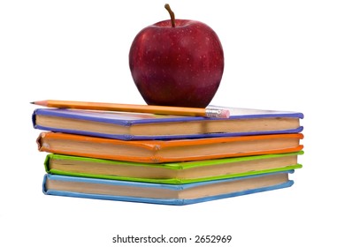 A Pile Of Childrens Books With A Pencil And Apple On Top. Teachers Pet