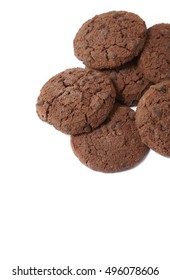 A pile of chocolate chunk cookies isolated on a white background forming a page border