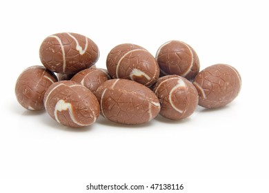 Pile of chocolate easter eggs isolated on white background