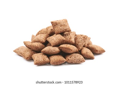 Pile of chocolate pillow cereals isolated over the white background