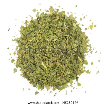 Pile chopped dried parsley leaves isolated on white background