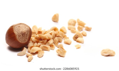 Pile chopped and roasted hazelnut isolated on white, side view - Powered by Shutterstock