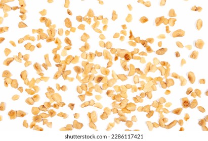 Pile chopped and roasted hazelnut isolated on white, top view - Shutterstock ID 2286117421