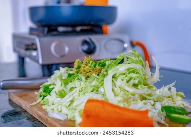 A pile of chopped vegetables in kitchen counter cabbage carrot etc. - Powered by Shutterstock