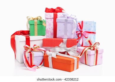 Pile Of Christmas Presents, Shot Over White Background