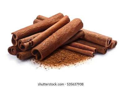 Pile of cinnamon sticks with ground cinnamon together. Clipping paths, shadow separated