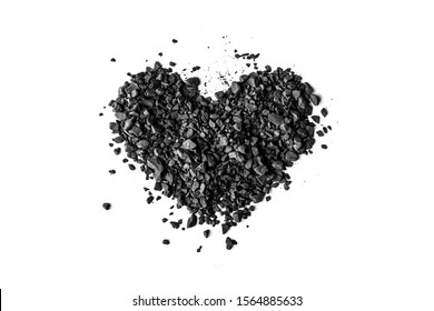 Pile of coal in shape of heart on white background, isolated, top view. Flat lay Stock fotografie