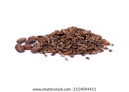 Pile of cocoa nib with dry cacao beans isolated on white background.