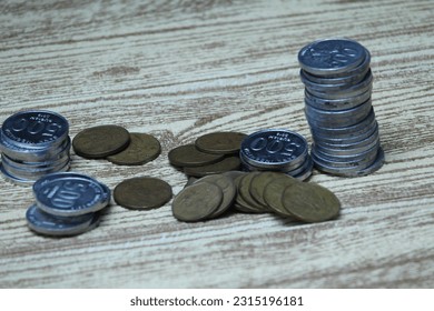 Pile of coins on the table. Financial and business concept. - Shutterstock ID 2315196181