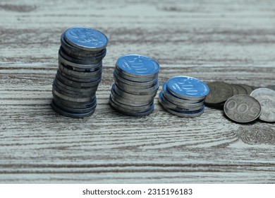 Pile of coins on the table. Financial and business concept. - Shutterstock ID 2315196183