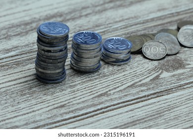 Pile of coins on the table. Financial and business concept. - Shutterstock ID 2315196191