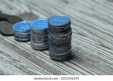 Pile of coins on the table. Financial and business concept. - Shutterstock ID 2315196195