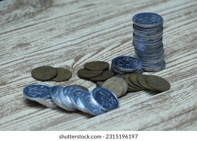 Pile of coins on the table. Financial and business concept. - Shutterstock ID 2315196197