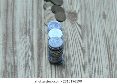 Pile of coins on the table. Financial and business concept. - Shutterstock ID 2315196199