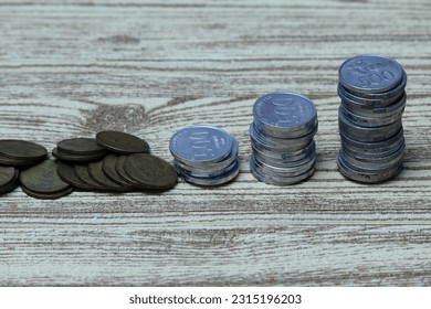 Pile of coins on the table. Financial and business concept. - Shutterstock ID 2315196203