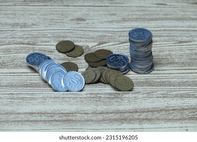 Pile of coins on the table. Financial and business concept. - Shutterstock ID 2315196205