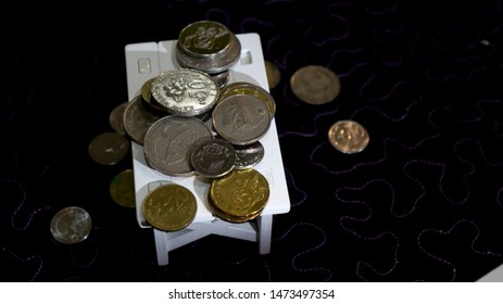 Pile of coins on the table using as financial and business marketing concept
