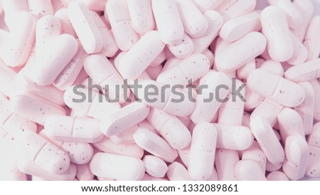 Pile of collagen supplements close-up background, an alternative protein treatment for beauty from within, based on capsule consumption for help or maintenance of skin, bones and ligaments healthy