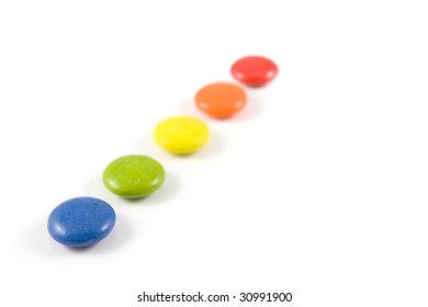 Pile Of Colored Smarties, Isolated Over White Background