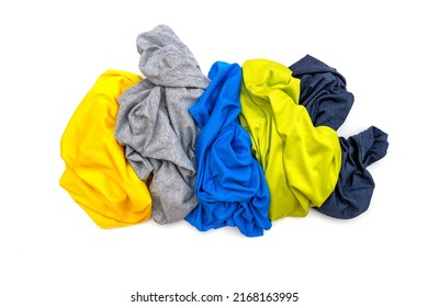 Pile of colored sport t-shirts isolated on white, top view	