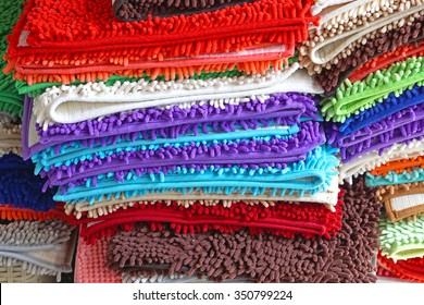 Pile Of Colorful Bathroom Rugs And Floor Mats