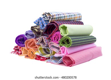 Pile Of Colorful Checkered Plaid Fabric Roll On A White Background