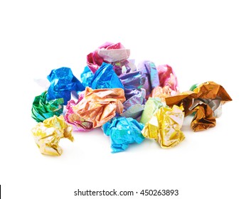 Pile of colorful crumbled origame paper sheet balls isolated over the white background