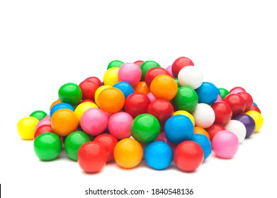 A pile of colorful gumballs on a white background.