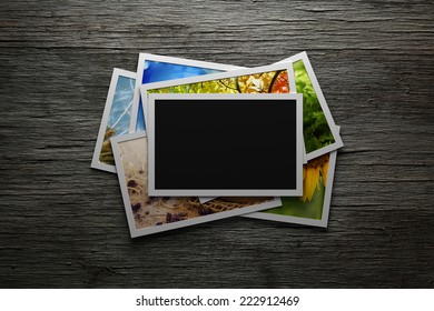 Pile Of Colorful Photos With Blank Frame