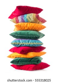 Pile of colorful pillows over white background