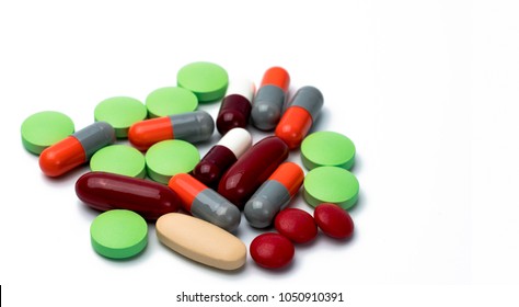 Pile Of Colorful Tablets And Capsule Pills Isolated On White Background. Drug, Vitamin, Supplement And Herbal Medicine Interactions . Drug Use In Pregnancy Woman. Drug Safety And Healthcare Concept
