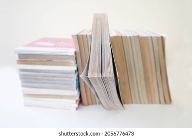 A Pile Of Comic Books. A Lot Of Japanese Manga Books On White Background.