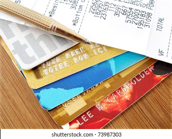 Pile Of Credit Cards With Pen And Receipt.