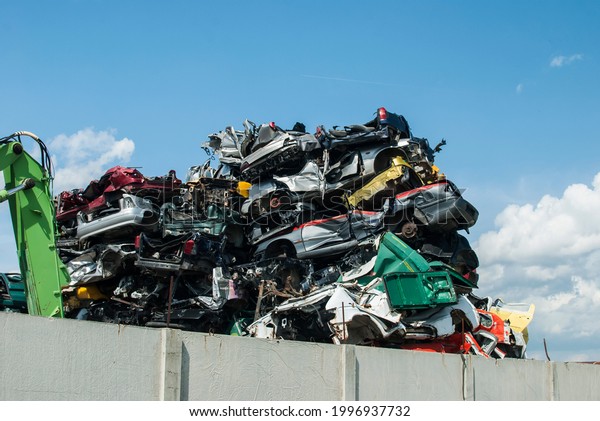 Pile of crushed junk\
cars on scrapyard