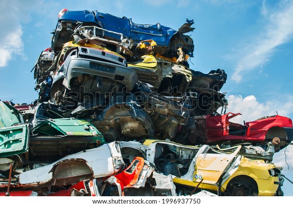 Pile of crushed junk\
cars on scrapyard