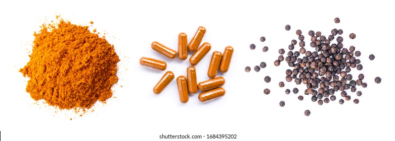 Pile of curcumin powder, Curcuma capsules and black peppercorns  isolated on white background. Health benefits and antioxidant food concept. Top view. Flat lay. 