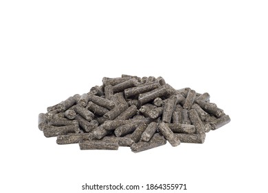 A Pile Of Dark Animal Feed Pellets Isolated On A White Background. The Concept Of A Composition Of Pellets For Feeding Farm Animals And Fish.