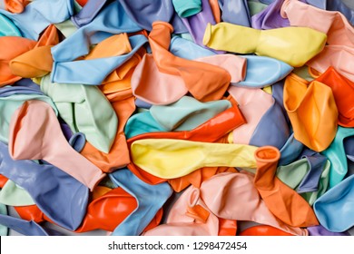 Pile Of Deflated Color Pastel Balloons On A White Background. Clean Pure Baloon Template. Logo, Texture, Pattern Presentation Plain Aerostat Design Element.