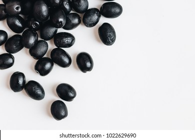 Pile Of Delicious Black Olives On White Background Pile Of Delicious Black Olives On White Background
