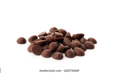 Pile of delicious dark chocolate chips on white background - Shutterstock ID 1205734369