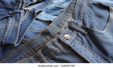 Pile Of Denim Jeans Close Up Shot