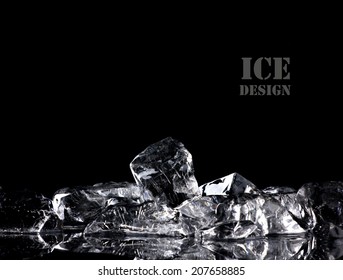 pile of different ice cubes on reflection table on  black background
